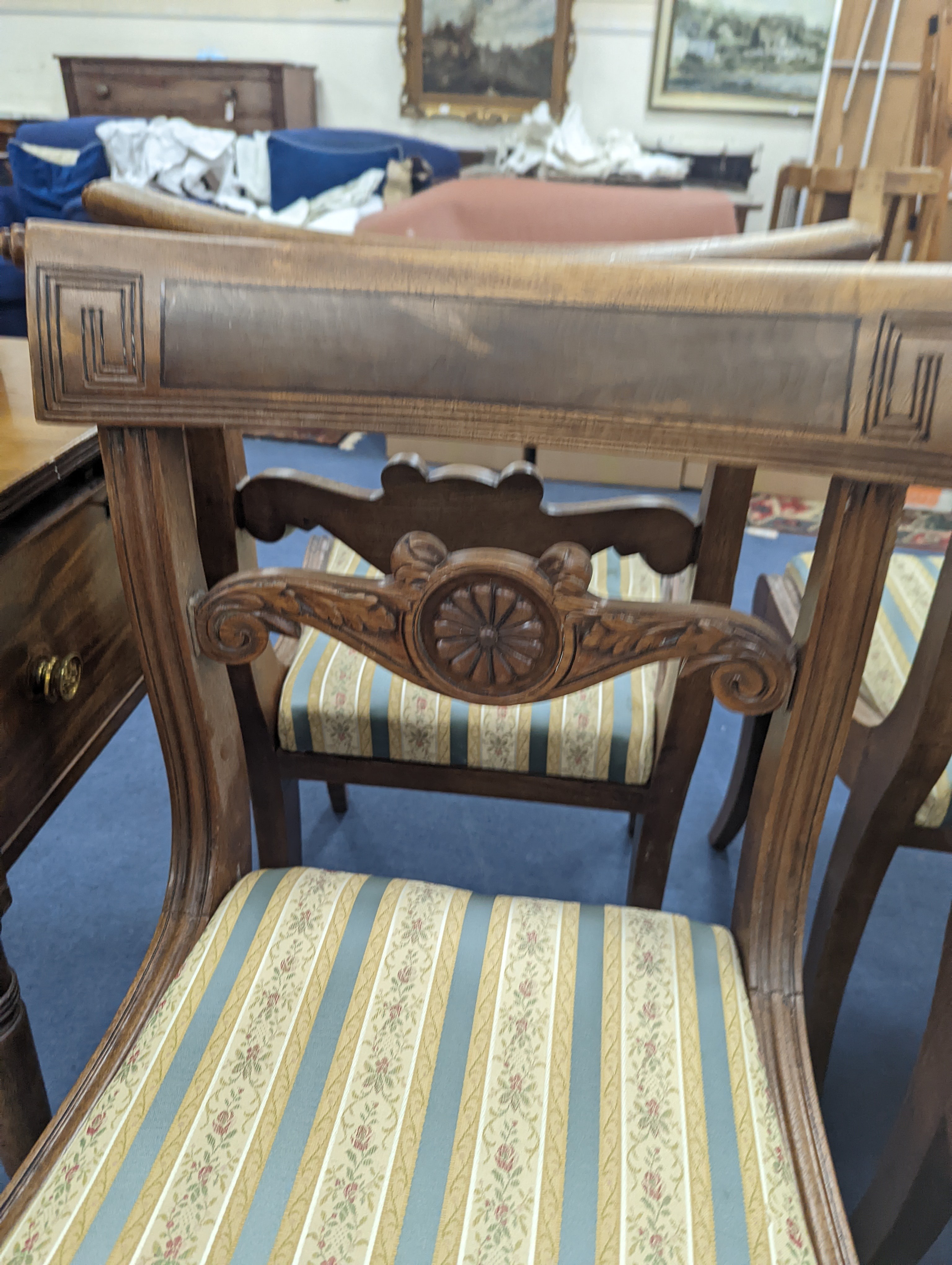 A set of six Regency mahogany dining chairs on sabre legs